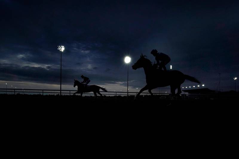 Runners make their way to the start of a race at Kempton Park Sunbury, England, on Monday July 13. Getty