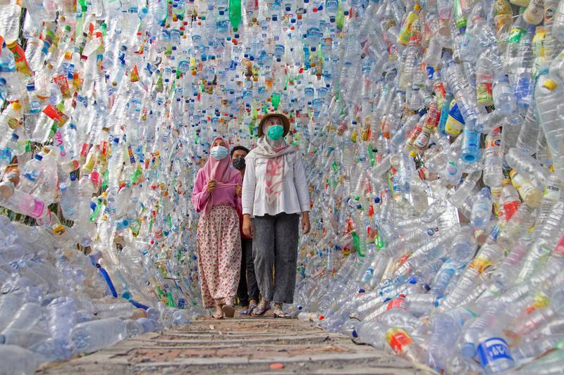 People walk through 'Terowongan 4444' or 4444 tunnel, made with plastic bottles collected from several rivers around the city over three years, at the museum built by Indonesia's environmental activist group Ecological Observation and Wetlands Conservation (Ecoton), in Gresik regency, near Surabaya in East Java province.  All photos: Reuters