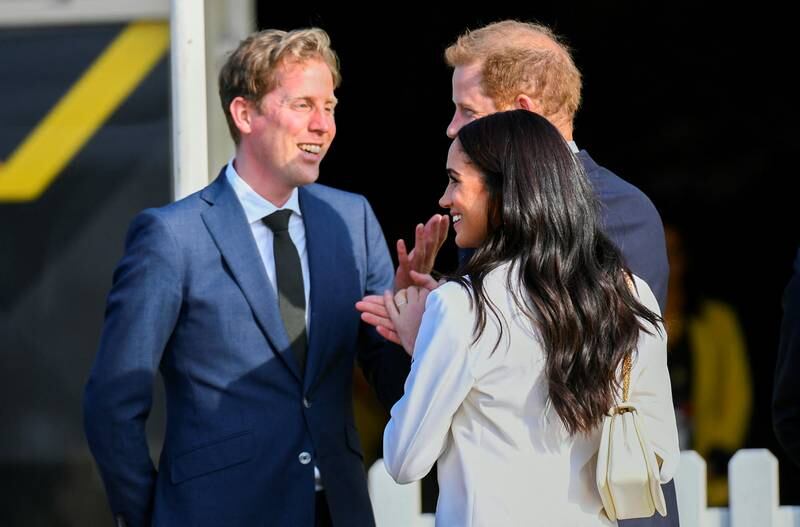 Britain's Prince Harry, who served in the British Army, and his wife Meghan, Duchess of Sussex, at a ceremony before the games open. Reuters