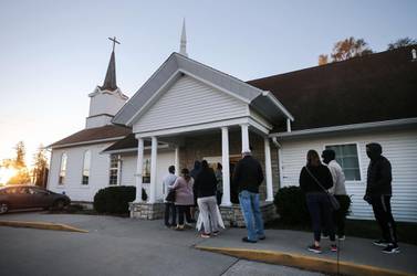 Voters gather at the Bloomfield United Methodist Church in Des Moines, Iowa, as polls open on November 3. Getty