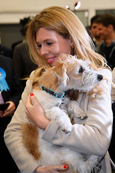 Carrie Symonds, partner of British Prime Minister Boris Johnson, holds their dog at the counting centre in Britain's general election in Uxbridge, Britain, December 13, 2019. REUTERS/Toby Melville