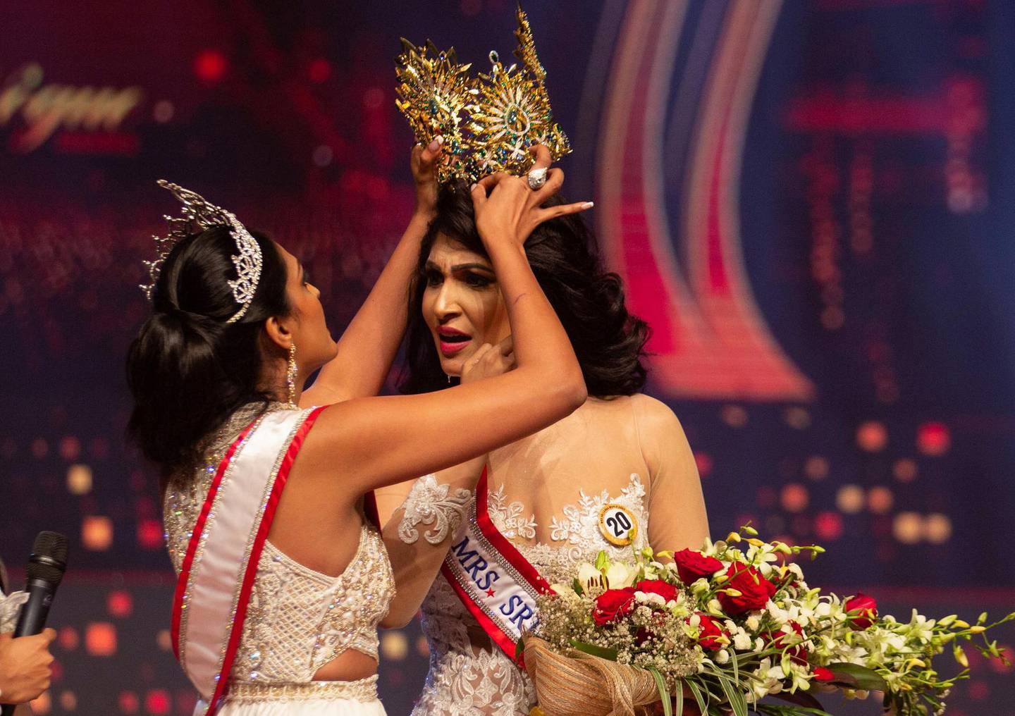 Reigning Mrs World Caroline Jurie, forcibly removes the Mrs Sri Lanka winner Pushpika De Silva's crown as Jurie declared that the winner was ineligible because she was divorced, during the Mrs Sri Lanka pageant, in Colombo, Sri Lanka April 4, 2021. Picture taken April 4, 2021. REUTERS/Gimhana Pathirana NO RESALES. NO ARCHIVES