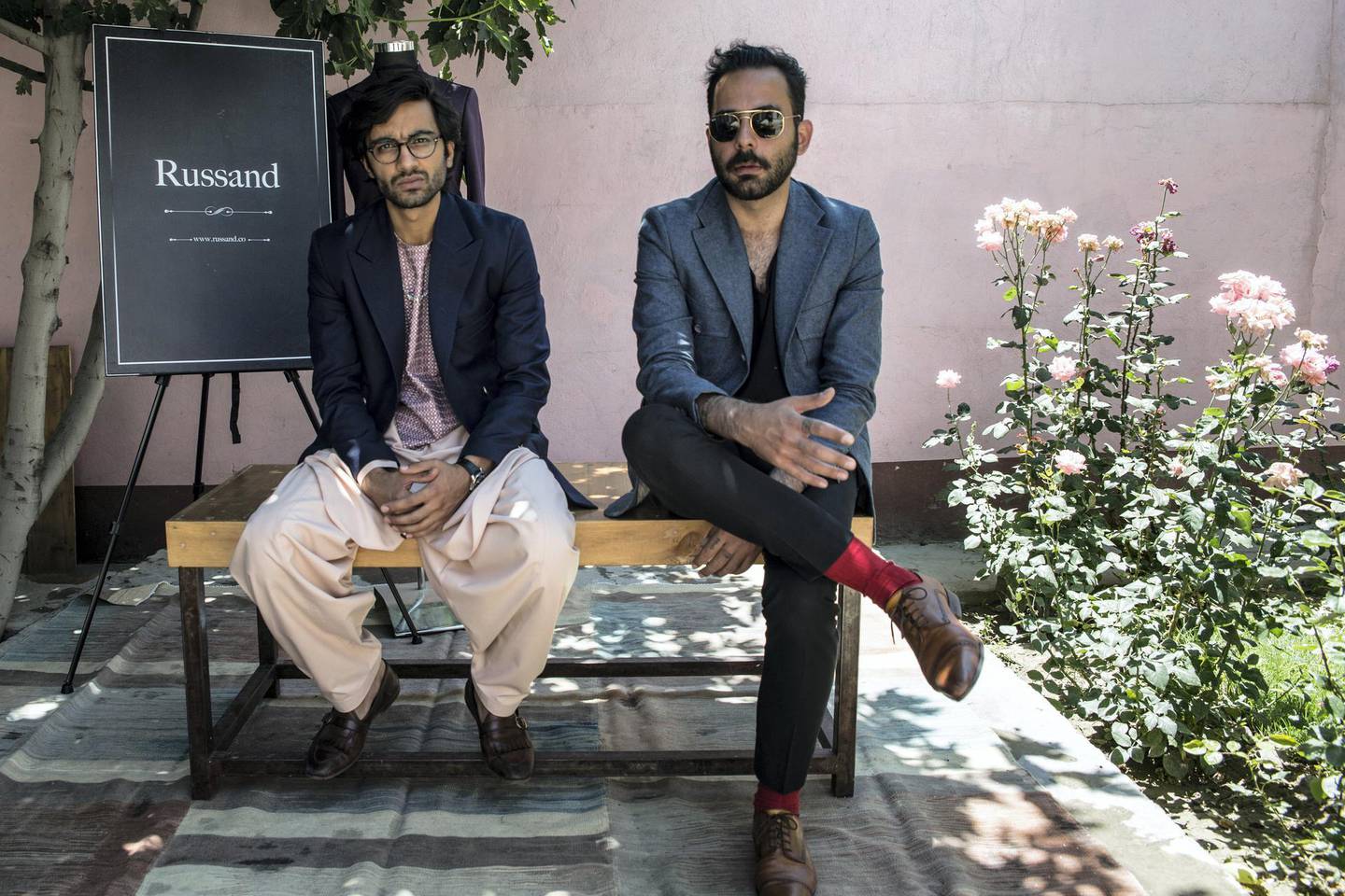 Entrepreneur Khalid Wardak, and owner of Russand, sits with his business partner and cousin Sabaoon Himmat outside their factory in Kabul. 