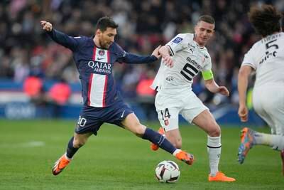 PSG's Lionel Messi challenges for the ball with Rennes' Benjamin Bourigeaud. AP Photo 