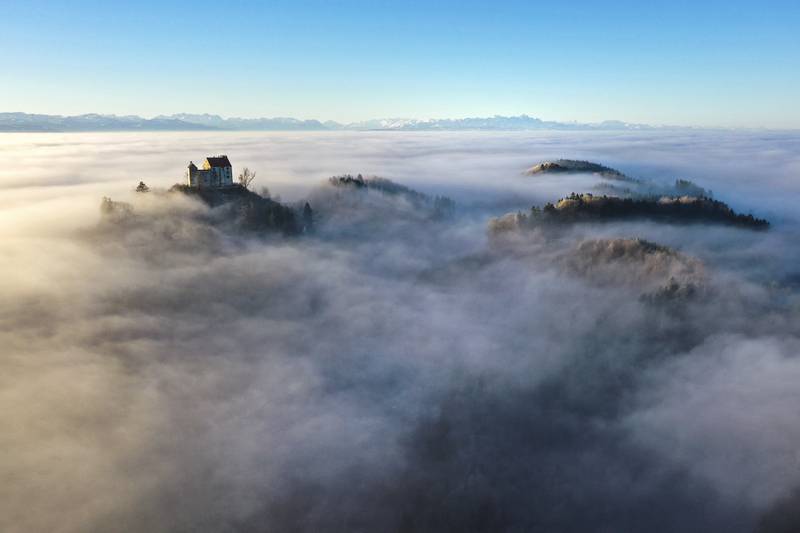 Waldburg Castle stands amid morning fog in Waldburg, Germany. AP