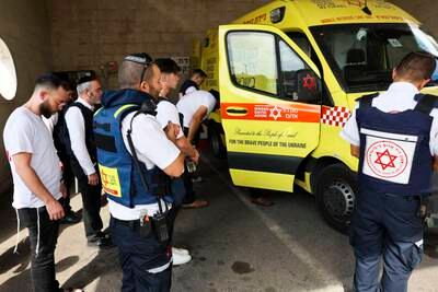 Paramedics from the Emergency Medical Services, the only health organisation that is operational in Sderot, Israel, pray before starting work. EPA
