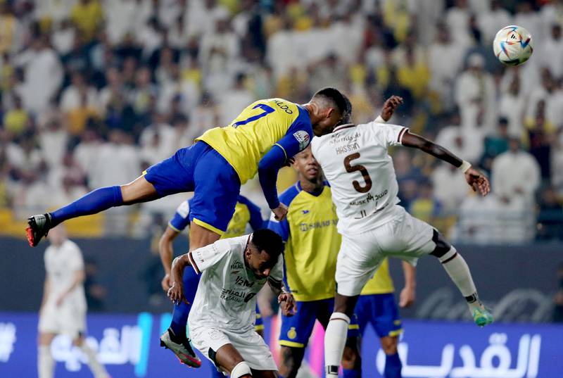 Al Nassr's Cristiano Ronaldo in action with Al Shabab's Hassan Tambakti. Reuters