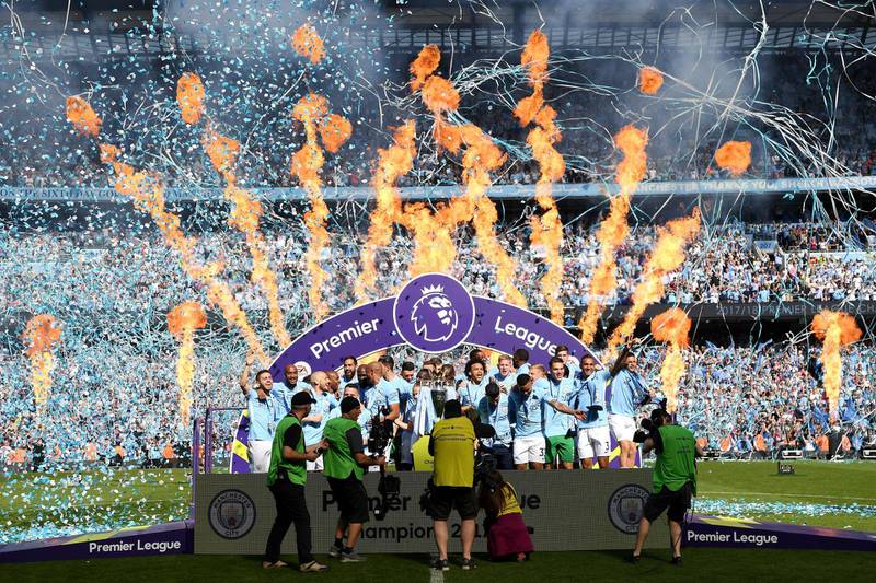 Vincent Kompany of Mancheter City  lifts The Premier League Trophy after the Premier League match between Manchester City and Huddersfield Town at Etihad Stadium in Manchester, England, on May 6, 2018. Shaun Botterill / Getty Images