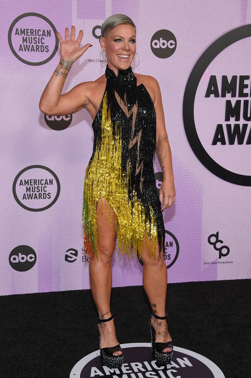 Pink wore a sparkling gold and black fringe Bob Mackie dress to the red carpet. AFP