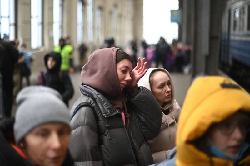 A Ukrainian woman cries as she boards a train in Lviv, western Ukraine, on her way to Poland. AFP