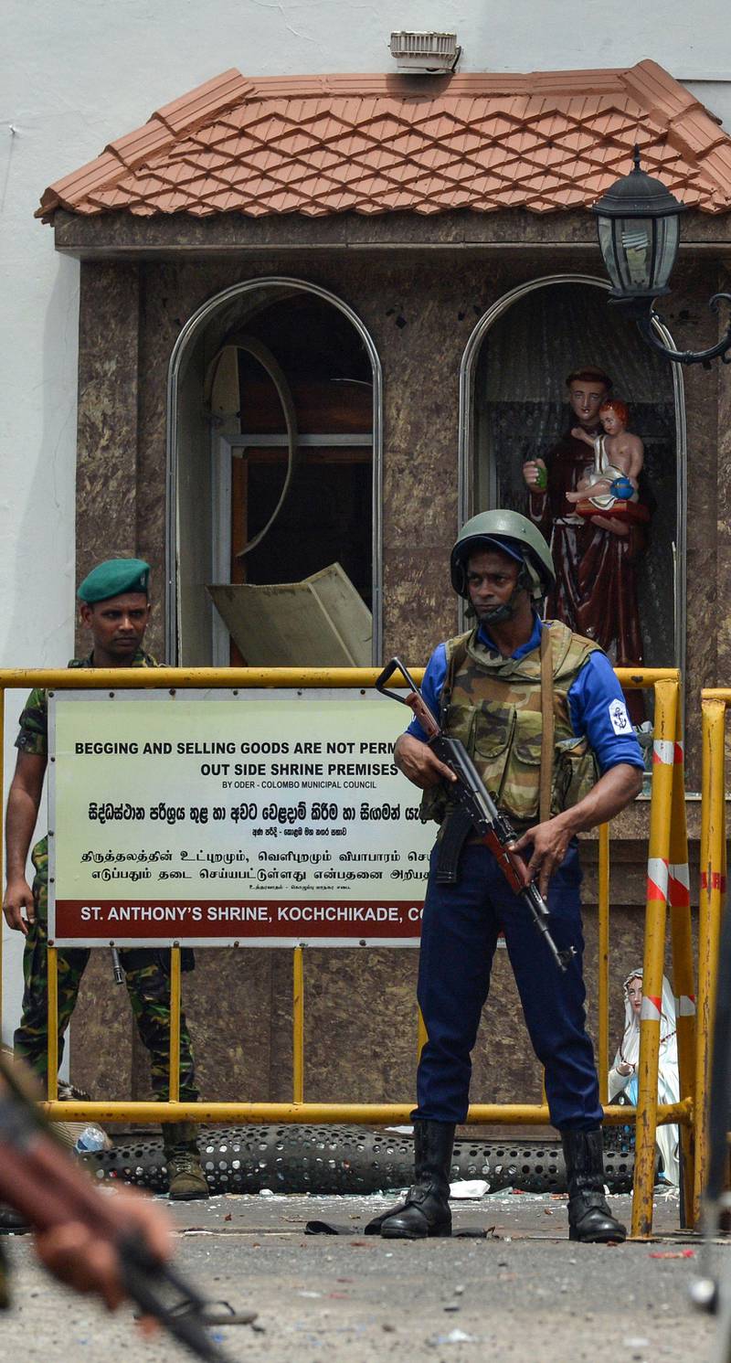 Sri Lankan security personnel keep watch outside St Anthony's Shrine in Kochchikade in Colombo.  AFP
