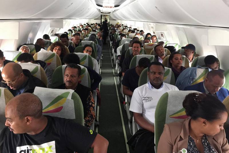 Passengers sit inside an Ethiopian Airlines ET314 flight to Eritrea's capital Asmara at the Bole International Airport in Addis Ababa, Ethiopia July 18, 2018. REUTERS/Tiksa Negeri