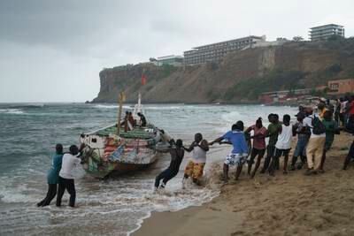 A capsized boat from which several migrants were found dead in Dakar, Senegal. AP