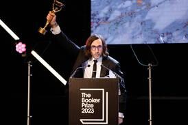 Paul Lynch, author of 'Prophet Song', accepts the 2023 Booker Prize. EPA