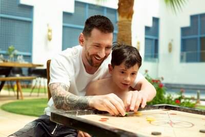 Lionel Messi, Saudi Tourism brand ambassador and his son enjoy learning how to play a popular board game called Carrom during a family break to the Kingdom. Photo: Saudi Tourism Authority