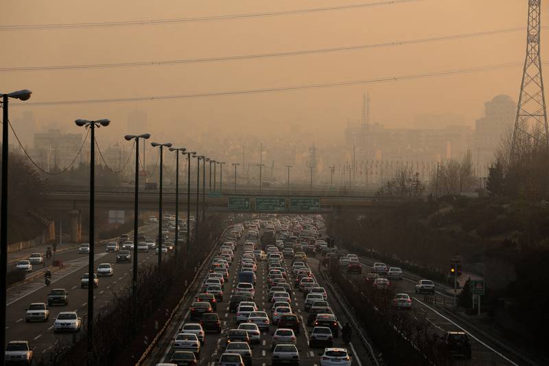 Traffic moves slowly in the Iranian capital Tehran in January as high levels of pollution engulf the city. Atta Kenare / AFP