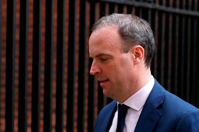 Britain's Foreign Secretary Dominic Raab leaves number 10, Downng Street in central London on March 18, 2020.   The British government will on Wednesday unveil a raft of emergency powers to deal with the coronavirus epidemic, including proposals allowing police to detain potentially infected people to be tested. / AFP / Adrian DENNIS
