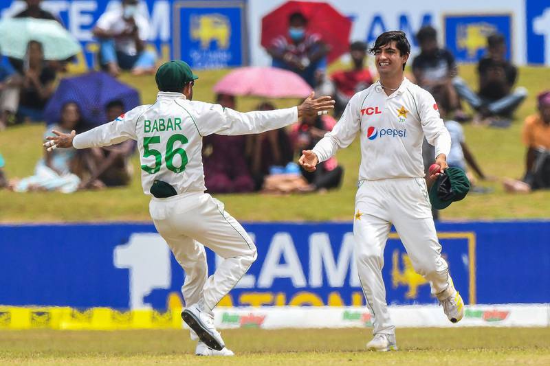 Pakistan bowler Naseem Shah celebrates with captain Babar Azam after taking the wicket of Sri Lanka captain Dimuth Karunaratne for 40. AFP