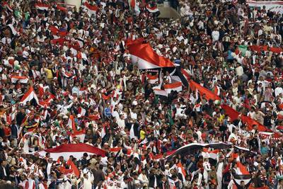 Yemeni fans cheer on their team during a 2014 Gulf Cup group round match against Qatar on Sunday in Riyadh. Karim Sahib / AFP