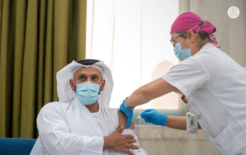 Sheikh Abdullah bin Mohammed Al Hamed, chairman of Abu Dhabi's Department of Health, participates clinical trials for the Covid-19 vaccine in Abu Dhabi. Abu Dhabi Government Media Office  