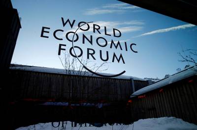 FILE PHOTO: A logo of the 50th World Economic Forum (WEF) annual meeting is pictured on a window in Davos, Switzerland, January 21, 2020. REUTERS/Denis Balibouse/File Photo