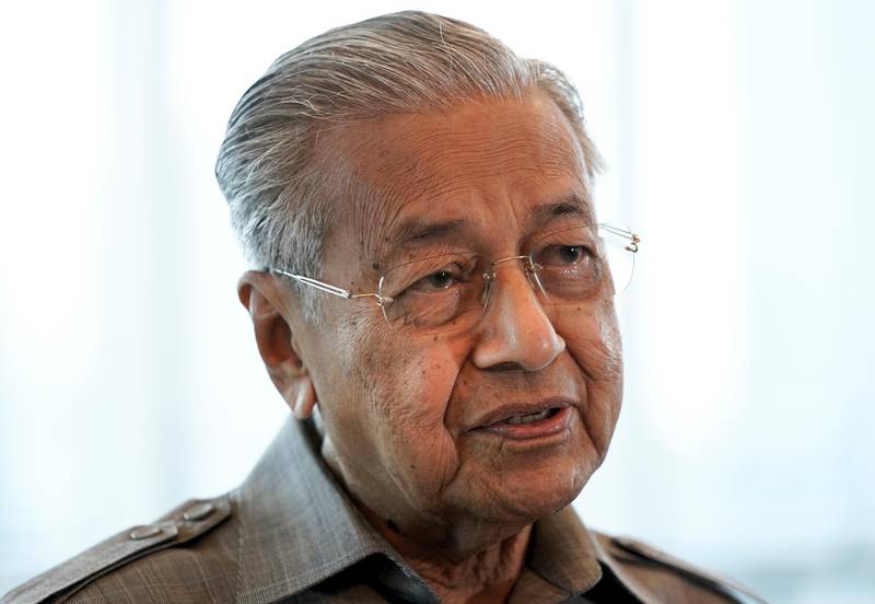 FILE - In this Sept. 4, 2020, file photo, former Prime Minister Mahathir Mohamad speaks during an interview with The Associated Press in Kuala Lumpur. Mahathir said Friday, Oct. 30, 2020, he is disgusted because his comments on attacks by Muslim extremists in France had been taken out of context. (AP Photo/Vincent Thian, File)