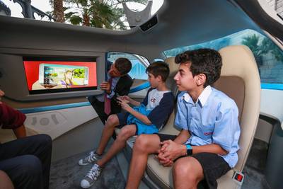 Pupils from the International School of Arts and Science watch the smart monitor of the Autonomous Smart Car. Victor Besa for The National.