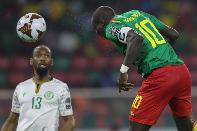 Cameroon forward Vincent Aboubakar heads the ball as Comoros' midfielder Rafidine Abdullah watches on. AFP