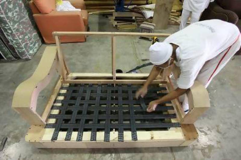Inmates making furniture in the craft section in Al Aweer in Dubai. Pawan Singh / The National