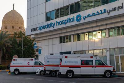 Ambulances sit outside the NMC Speciality Hospital, operated by NMC Health Plc, in Dubai, United Arab Emirates, on Sunday, March 1, 2020. Troubled NMC Health Plc, the largest private health-care provider in the United Arab Emirates, asked lenders for an informal standstill on its debt as Dubai weighs an injection of capital to safeguard the emirate’s reputation among global investors. Photographer: Christopher Pike/Bloomberg