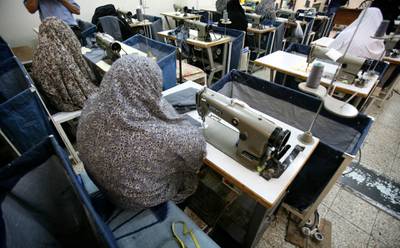 Iranian women prisoners work at a tailoring workshop in Tehran's Evin prison June 13, 2006. Iranian police detained 70 people at a demonstration in favour of women's rights, the judiciary said on Tuesday, adding it was ready to review reports that the police had beaten some demonstrators.