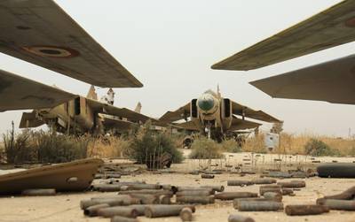 A general view shows former Syrian army MiG-23 fighter jets at the Abu Duhur military airport, the last regime-held military base in northwestern Idlib province, after Al-Qaeda's Syrian affiliate and its allies seized the base on September 9, 2015 in the latest setback for President Bashar al-Assad's forces. Al-Nusra Front and a coalition of mostly Islamist groups captured the military airport after a siege that lasted two years, the Syrian Observatory for Human Rights monitor said. AFP PHOTO / OMAR HAJ KADOUR (Photo by OMAR HAJ KADOUR / AFP)