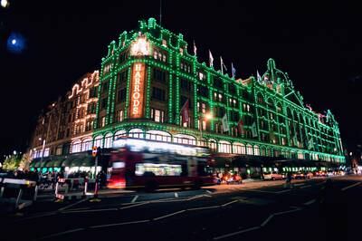 The exterior Harrods Department Store is lit up during the Christmas period.