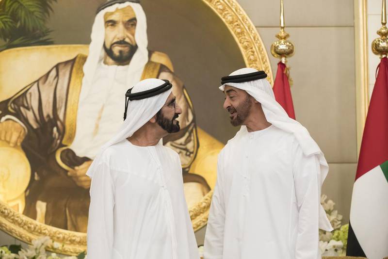 Sheikh Mohammed bin Zayed, Crown Prince of Abu Dhabi Deputy Supreme Commander of the Armed Forces, speaks with Sheikh Mohammed bin Rashid, Vice President and Ruler of Dubai, during an iftar reception at Mushrif Palace. Ryan Carter / Crown Prince Court - Abu Dhabi