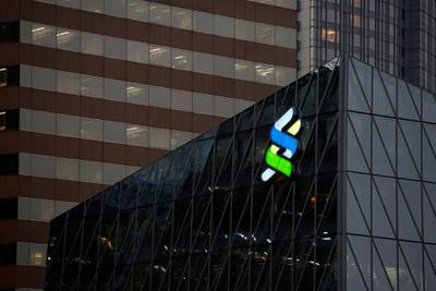 FILE PHOTO: A logo of Standard Chartered is displayed at the financial Central district in Hong Kong, China November 23, 2017.      REUTERS/Bobby Yip/File Photo  GLOBAL BUSINESS WEEK AHEAD