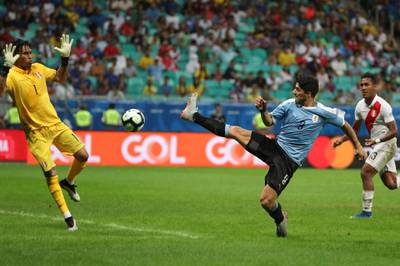 Luis Suarez has a shot on goal blocked by Peru goalkeeper Pedro Gallese. AP Photo
