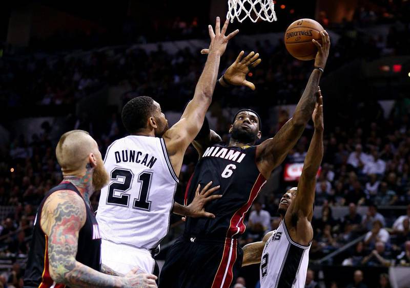 LeBron James, No 6, of the Miami Heat goes to the basket against Tim Duncan of the San Antonio Spurs during Game 2 of the 2014 NBA Finals at the AT&T Center on June 8, 2014 in San Antonio, Texas. Andy Lyons / Getty Images