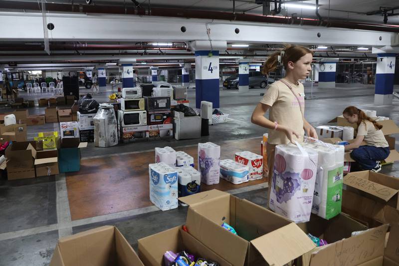 Young people are being encouraged to avoid social media apps and instead volunteer to prepare aid packages for Israeli soldiers and residents evacuated from southern Israel. AFP