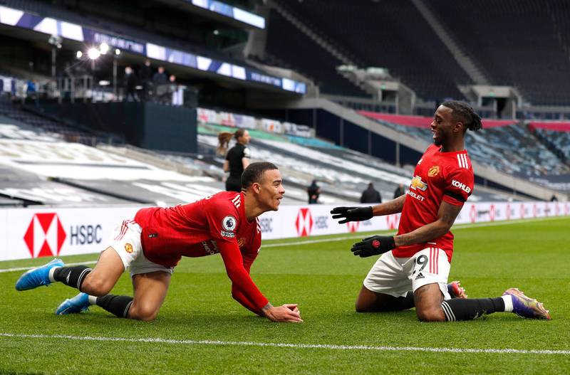 Mason Greenwood, left, celebrates scoring United's third goal with Aaron Wan-Bissaka. Getty