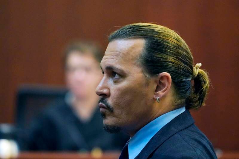 US actor Johnny Depp looks on in the courtroom as his agent testifies. EPA