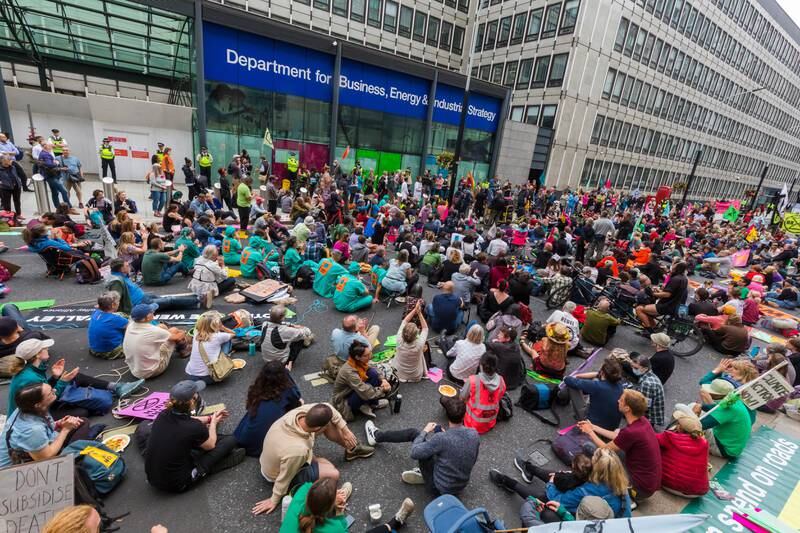 Extinction Rebellion demonstrators block the road in Victoria Street outside the Department for Business, Energy and Industrial Strategy in London. EPA