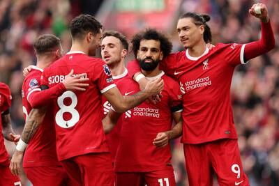 Liverpool celebrate Mohamed Salah's match winning penalty. Getty
