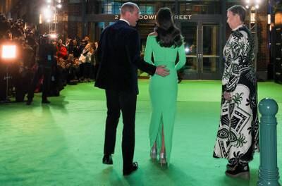 Prince William shows a bit of affection for wife Kate. Reuters