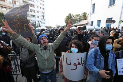 Protesters shout slogans during a demonstration next to the Tunisian parliament in Tunis. EPA
