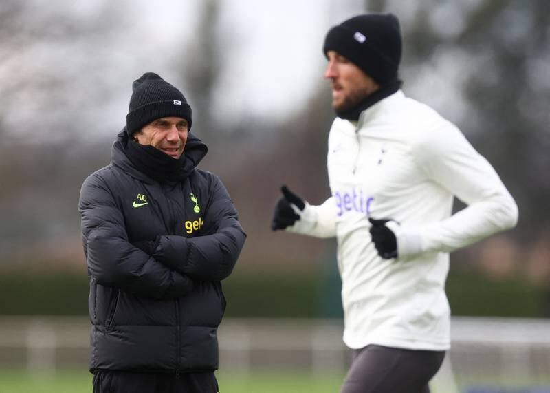 Tottenham Hotspur manager Antonio Conte watches star striker Harry Kane in training. Reuters