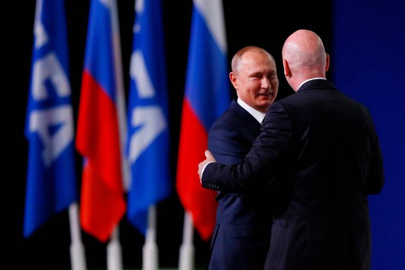 Russian President Vladimir Putin is greeted by FIFA President Gianni Infantino during the 68th FIFA Congress at the Moscow Expocentre in Moscow, Russia, on June 13, 2018. Kevin C. Cox / Getty Images