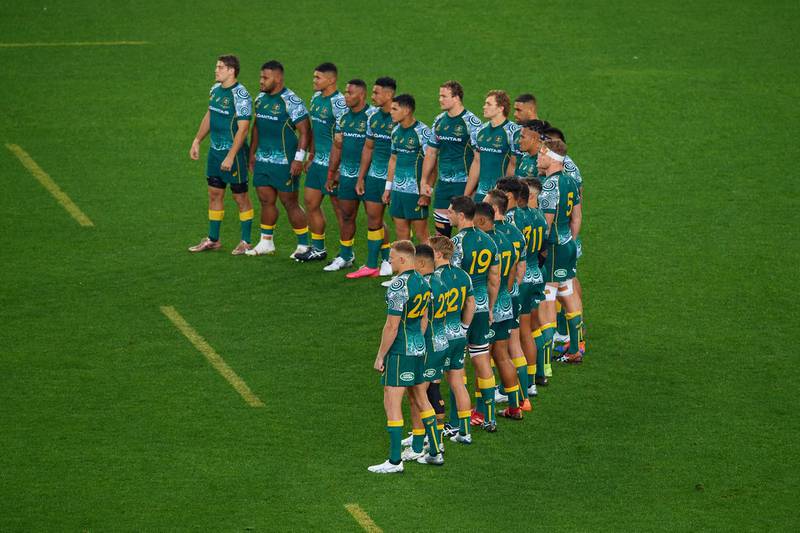 Wallabies players look on as the All Blacks perform the Haka. Getty