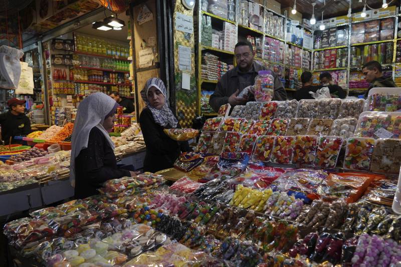 Women shop for sweets to enjoy during the holy month of Ramadan, at a traditional market in Gaza city. AP Photo