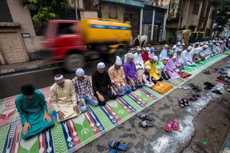 epa06178482 Indian Muslims offer Eid al-Adha prayers near a masjid in Calcutta, India, 02 September 2017. Eid al-Adha is the holiest of the two Muslims holidays celebrated each year, it marks the yearly Muslim pilgrimage (Hajj) to visit Mecca, the holiest place in Islam. Muslims slaughter a sacrificial animal and split the meat into three parts, one for the family, one for friends and relatives, and one for the poor and needy.  EPA/PIYAL ADHIKARY