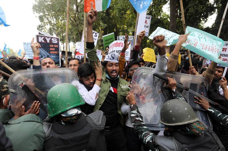 Security personnel and protesters clash at a demonstration in solidarity with Indian farmers in New Delhi, India. Farmers say new laws leave them at the mercy of corporations. EPA